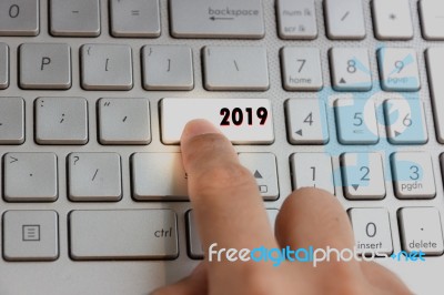 Finger Pressing Keyboard Key Written 2019 New Year On Laptop Stock Photo