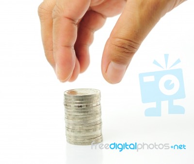 Finger With Stacked Coins Stock Photo