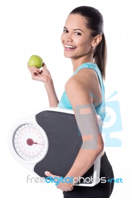 Fir Woman With Weighing Scale And Green Apple Stock Photo