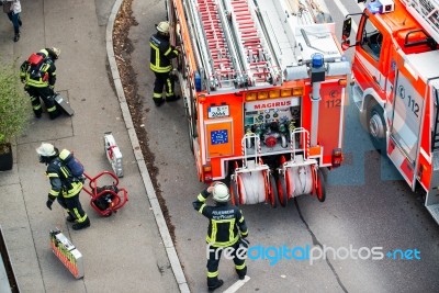 Fire Fighters In Action Stock Photo