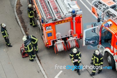 Fire Fighters In Action Stock Photo
