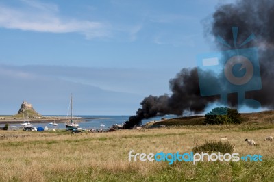 Fire On Holy Island Stock Photo