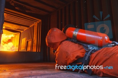 Firefighter Crawling Stock Photo