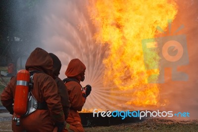 Firefighters Putting Out Fire Stock Photo