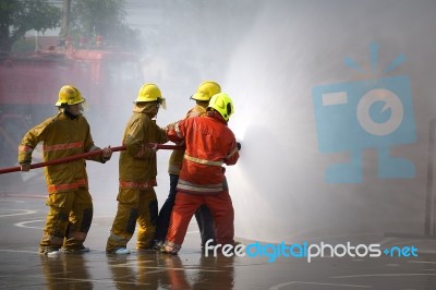 Fireman. Firefighters Fighting Fire During Training Stock Photo Fireman. Firefighters Fighting Fire During Training Stock Photo