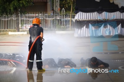 Fireman. Firefighters Fighting Fire During Training Stock Photo