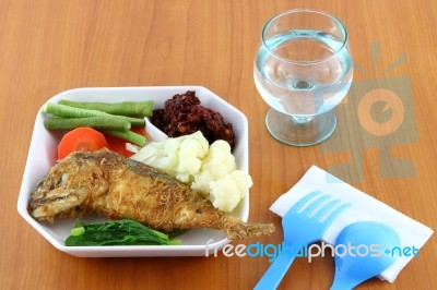 Fish Fried With Vegetables Stock Photo