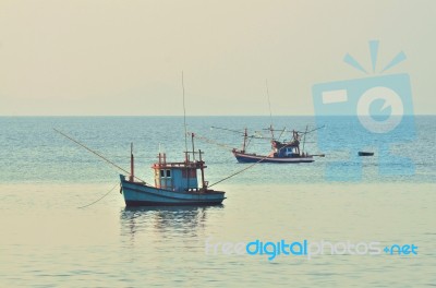 Fisherman Boat In Sea Stock Photo