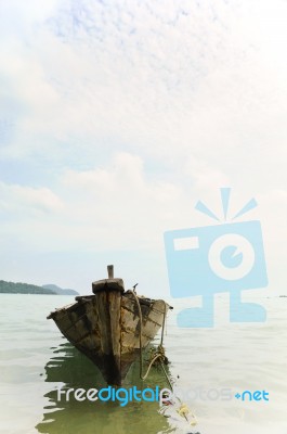 Fishing Boat Anchored On The Shore Stock Photo Fishing Boat Anchored On The Shore Stock Photo