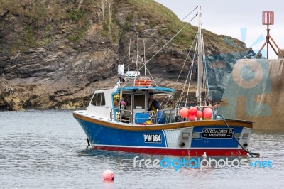 Fishing Boat In Port Isaac Cornwall Stock Photo