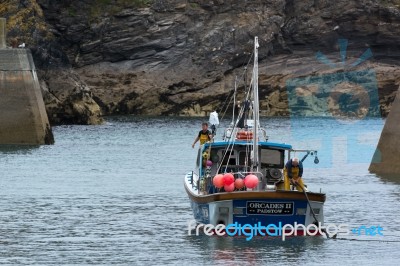 Fishing Boat In Port Isaac Cornwall Stock Photo
