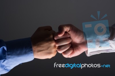 Fist Bump Handshake Between Businessmen Stock Photo