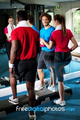 Fit People Working Out In Fitness Centre Stock Photo