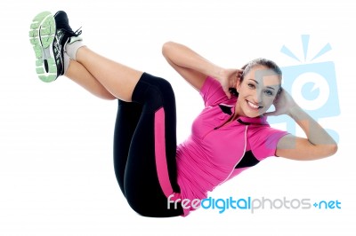 Fit Smiling Woman Doing Crunches Stock Photo