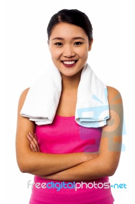 Fit Smiling Woman With Towel Around Her Neck Stock Photo