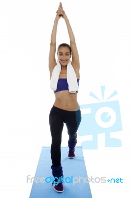 Fit Woman Doing Stretching Exercise Stock Photo