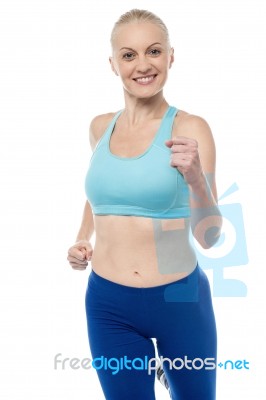 Fit Woman In Jogging Posture Stock Photo