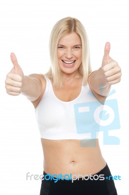 Fit Woman In Sports Bra Gesturing Double Thumbs Up Stock Photo
