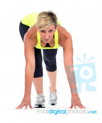 Fitness Middle Age Woman In A Start Position Stock Photo