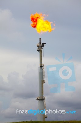 Flare Stack At Oil And Gas Refinery Plant Stock Photo