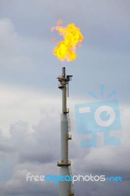 Flare Stack At Oil And Gas Refinery Plant Stock Photo
