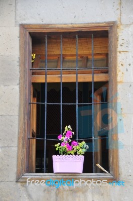 Flowers In Pots On The Balcony Next To Window Stock Photo
