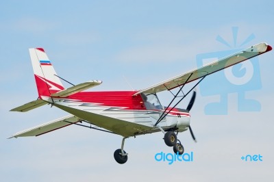 Flying Small Airplane Stock Photo