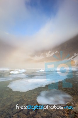 Fog Over Iceberg Lake, Glacier National Park Stock Photo
