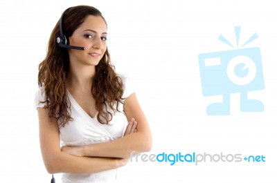 Folded Arm Female Talking On Headphone Stock Photo