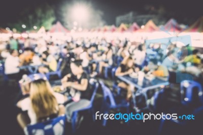 Food Festival Event With Blurred People Stock Photo