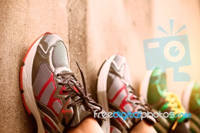 Foot Wear Shoes On The Wall Stock Photo