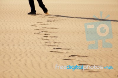 Footprints On The Sand Stock Photo