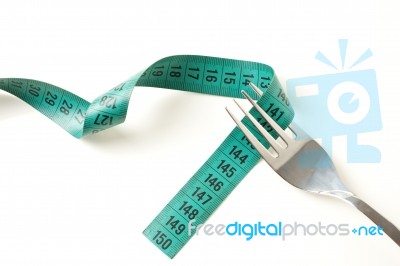 Fork And Measuring Tape Stock Photo