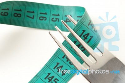 Fork And Measuring Tape Stock Photo