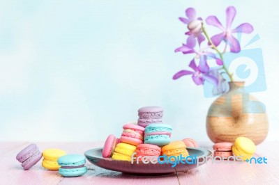 French Macarons On Pink Wooden Background. Vintage Style Stock Photo