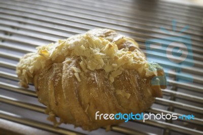 Fresh Baked Almond Croissant For Sale Stock Photo