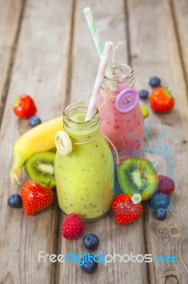 Fresh Blended Fruit Smoothies In Vintage Milk Bottles Stock Photo