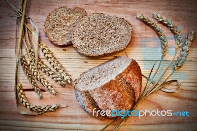 Fresh Bread On A Wooden Table Stock Photo