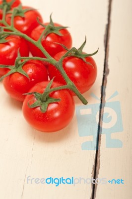 Fresh Cherry Tomatoes On A Cluster Stock Photo