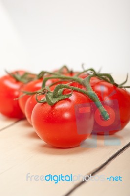 Fresh Cherry Tomatoes On A Cluster Stock Photo