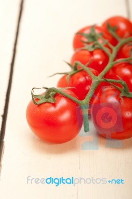 Fresh Cherry Tomatoes On A Cluster Stock Photo