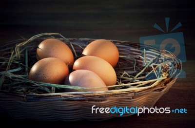 Fresh Eggs On Rice Straw Basket Stock Photo