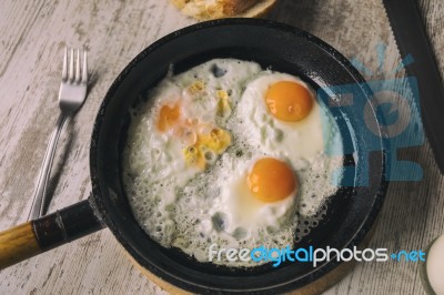 Fresh Fried Eggs On Oil Stock Photo