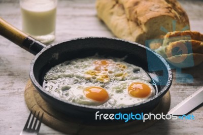 Fresh Fried Eggs On Oil Stock Photo
