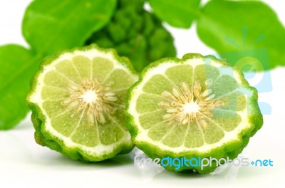 Fresh Fruits And Green Leaves Of Kiffir Lime Or Leech Lime On Wh… Stock Photo