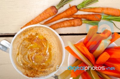 Fresh Hummus Dip With Raw Carrot And Celery Stock Photo