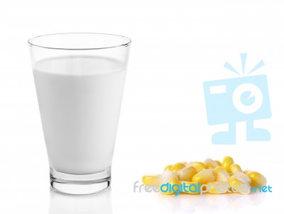 Fresh Milk In The Glass With Corn On White Background Stock Photo