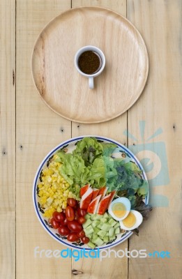 Fresh Mixed Vegetables On Vintage Plate With Japanese Dressing Stock Photo