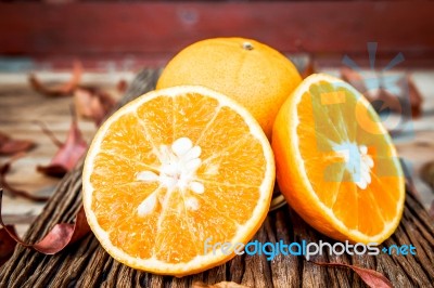 Fresh Oranges On Wooden Table Stock Photo