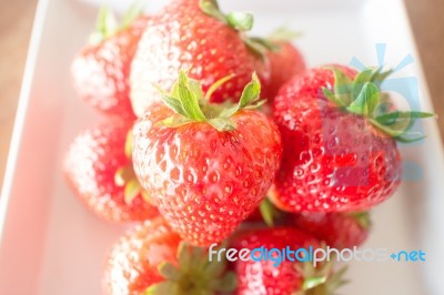 Fresh Ripe Strawberries On White Plate Stock Photo